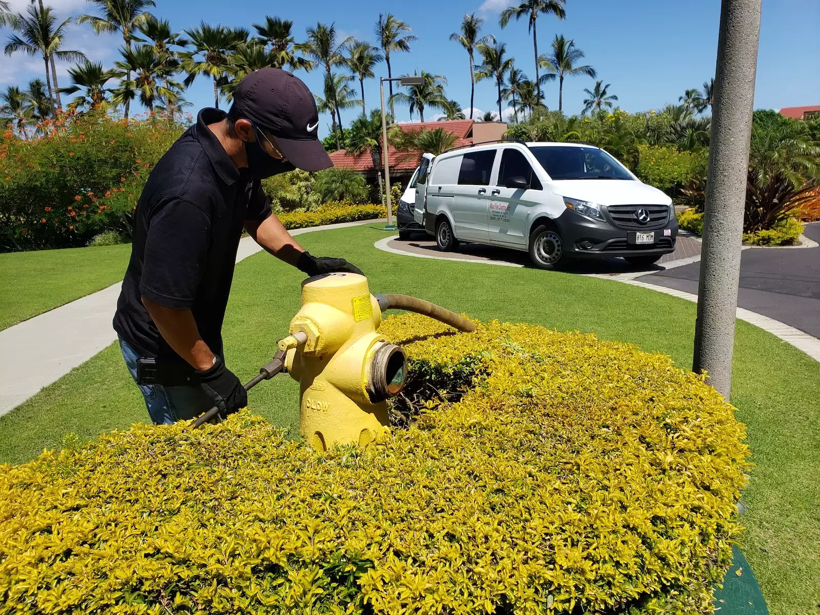 Maui Fire Control technician servicing fire equipment